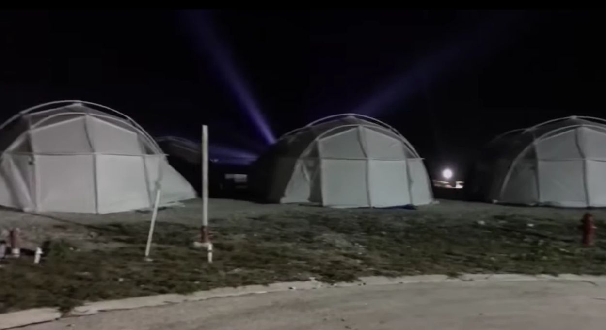 Image may contain: Building, Camping, Person, Human, Tent