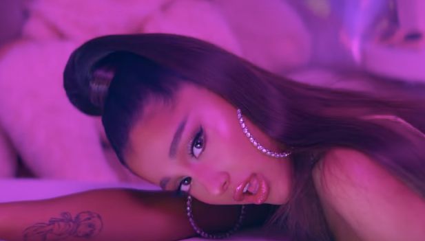 Image may contain: Ariana Grande blackfish, Ariana Grande, Clothing, Hat, Apparel, Head, Piercing, Person, Face, Human
