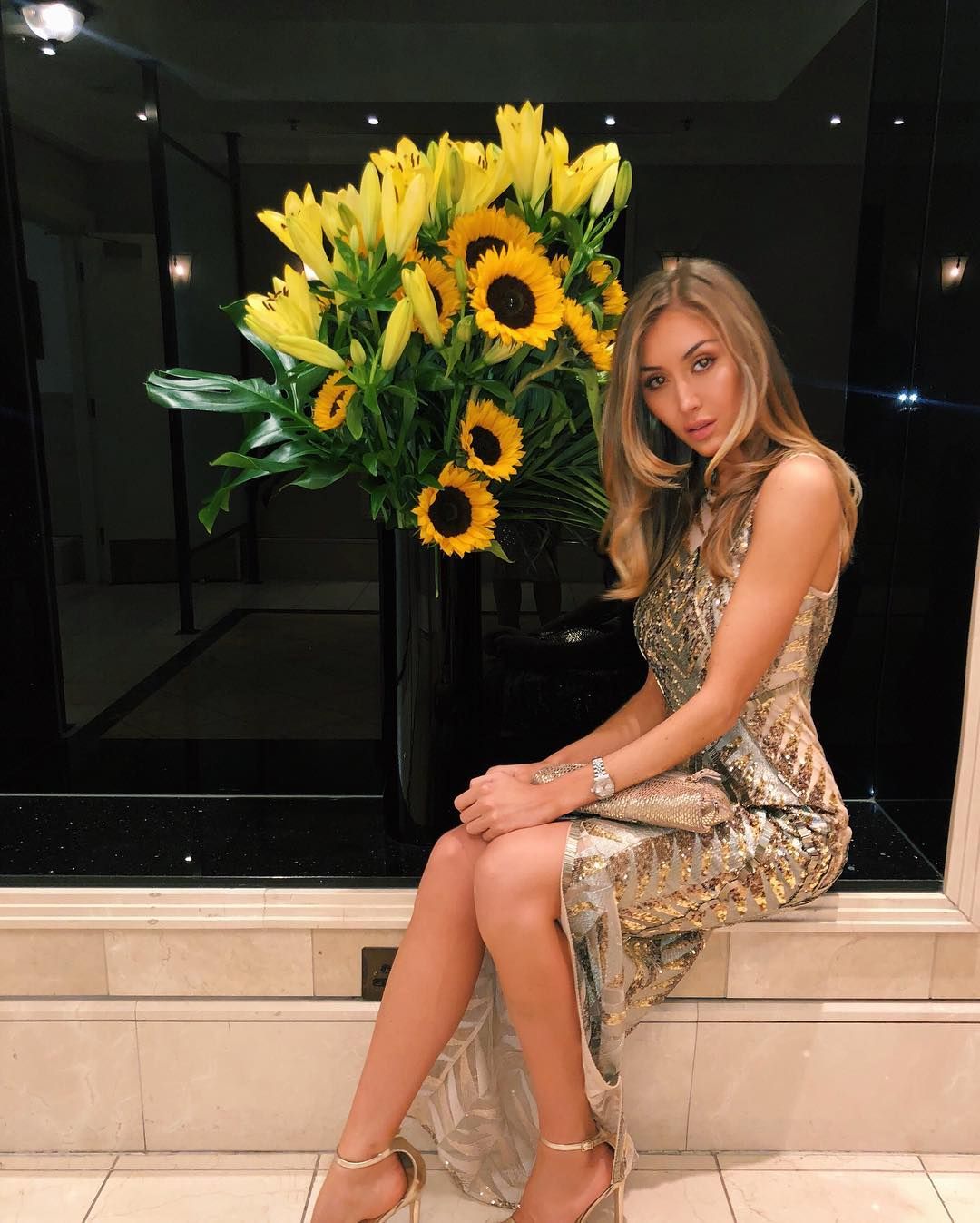 Image may contain: Flower Bouquet, Flower Arrangement, Evening Dress, Fashion, Robe, Gown, Flower, Blossom, Footwear, Shoe, Plant, Human, Person, Apparel, Clothing