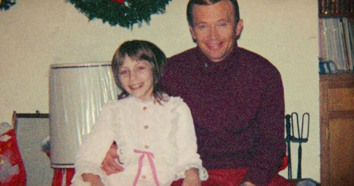 Image may contain: Broberg family now, Jan Broberg, Robert Berchtold, Abducted in Plain Sight, Portrait, Photography, Photo, Woman, Kid, Child, Girl, Teen, Chair, Dress, Female, Pants, Smile, Furniture, Face, Human, Person, Clothing, Apparel
