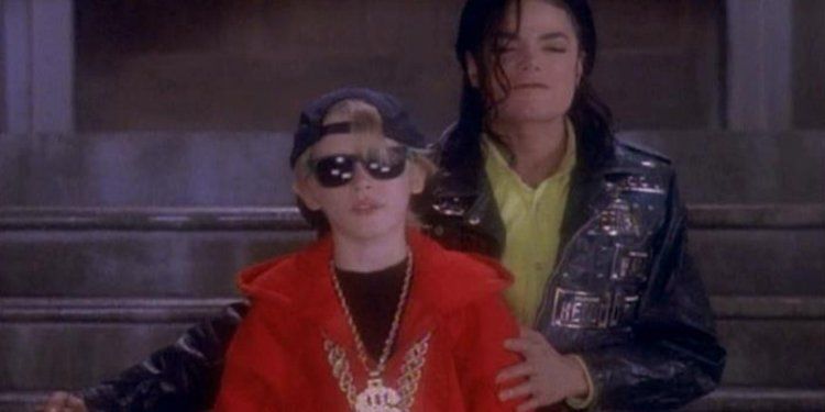 Image may contain: Michael Jackson and Macaulay Culkin, Macaulay Culkin, Michael Jackson, Leaving Neverland, Female, Glasses, Coat, Jacket, People, Face, Sunglasses, Accessory, Accessories, Person, Human, Apparel, Clothing