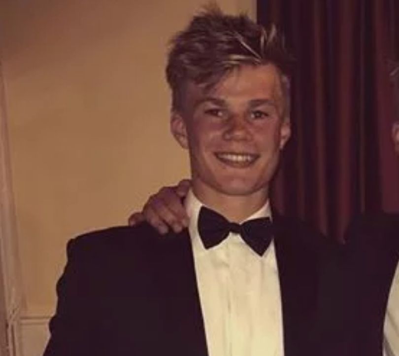 Image may contain: Man, Performer, Face, Person, Human, Tuxedo, Suit, Apparel, Coat, Clothing, Overcoat
