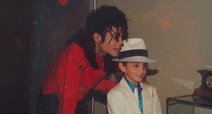 Image may contain: celebrities react to Leaving Neverland, Leaving Neverland, Michael Jackson, documentary, Wade Robson, Suit, Overcoat, Accessories, Accessory, Glasses, Coat, Man, Hair, Portrait, Photography, Photo, Smile, Dating, Blonde, Girl, Kid, Child, Teen, Woman, Hat, Female, Human, Person, Face, Clothing, Apparel