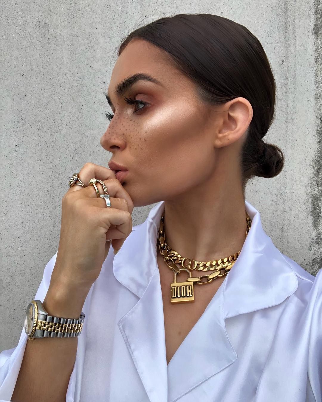 Image may contain: Apparel, Clothing, Finger, Pendant, Jewelry, Necklace, Accessories, Accessory, Person, Human