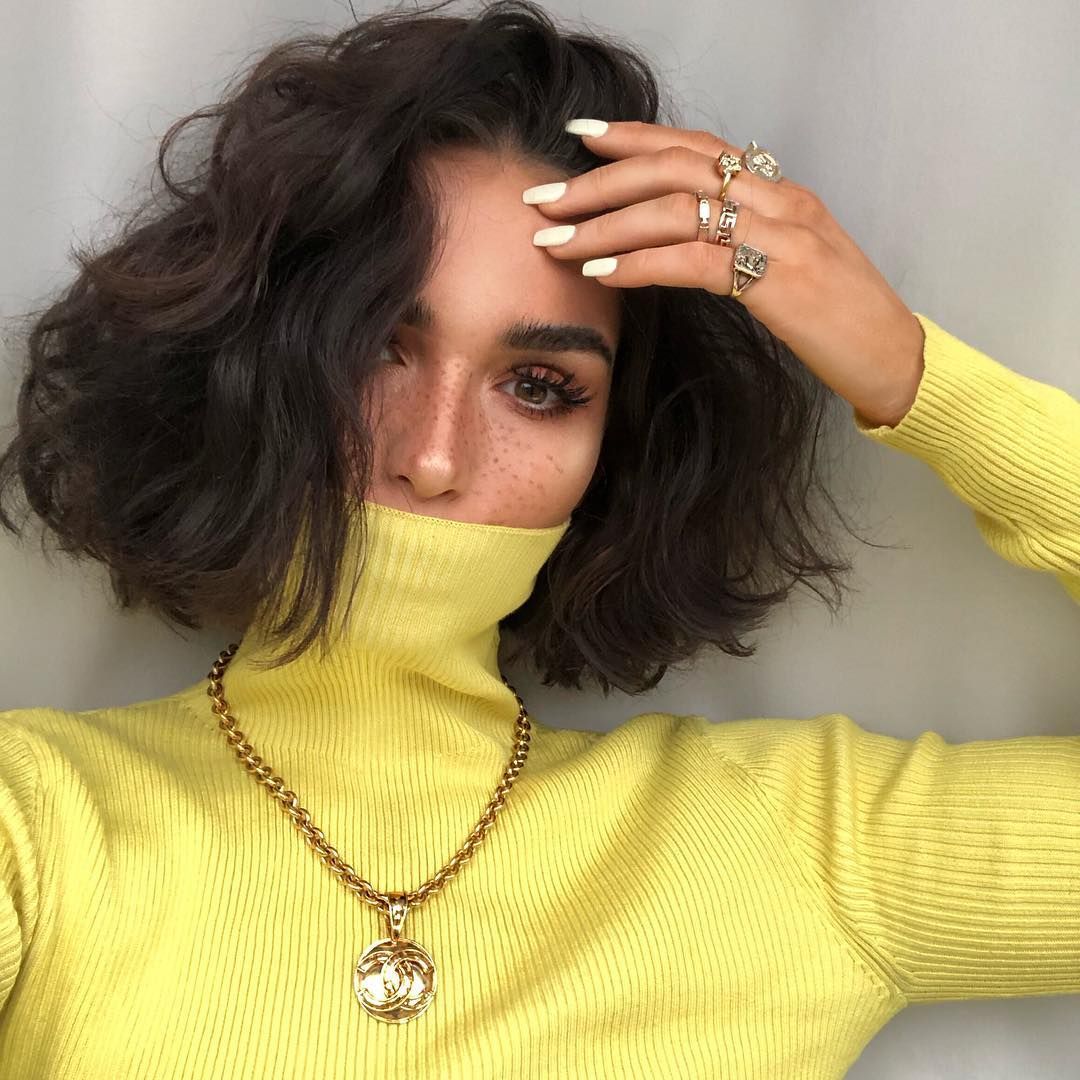 Image may contain: Finger, Apparel, Clothing, Pendant, Person, Human, Accessories, Jewelry, Necklace, Accessory