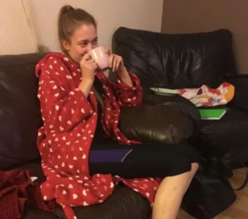 Image may contain: Pajamas, Chair, Human, Person, Furniture, Couch, Apparel, Clothing