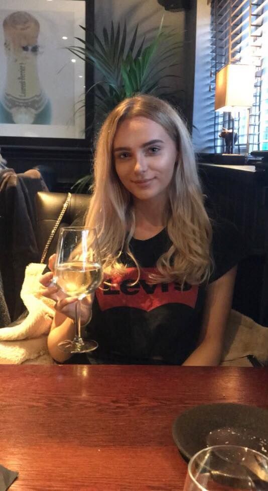 Image may contain: Table, Couch, Wine Glass, Wine, Bar Counter, Pub, Teen, Kid, Woman, Girl, Child, Blonde, Alcohol, Dating, Face, Female, Drink, Beverage, Furniture, Glass, Person, Human