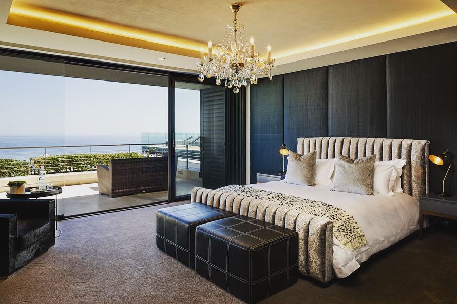 Image may contain: Moondance Villa, Cape Town, Made in Chelsea, South Africa, villa,  Bed, Indoors, Room, Bedroom, Lamp, Chandelier, Furniture