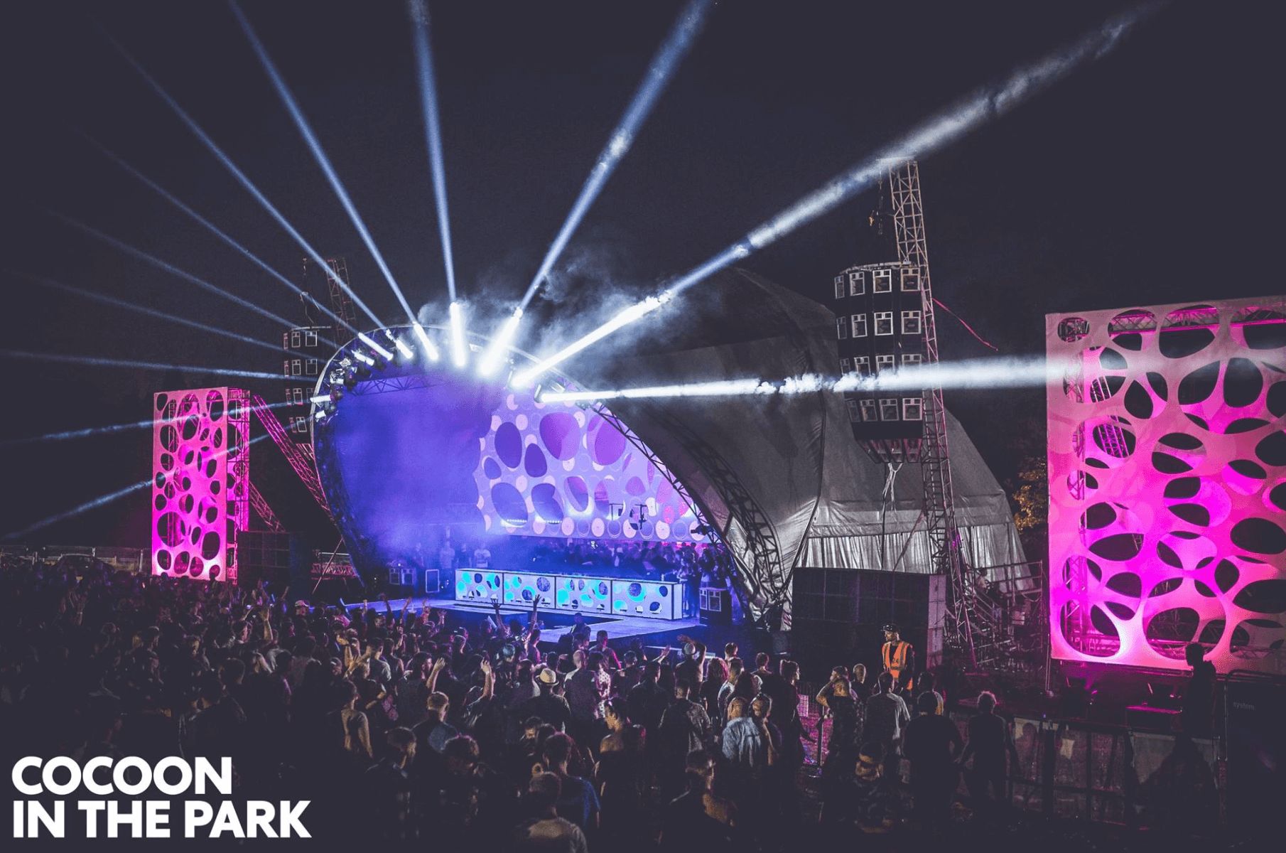 Image may contain: Festival guide, 2019, ticket price, line up, what to wear, festivals, UK, British, Cocoon in the Park, Glastonbury, Building, Concert, Lighting, Human, Crowd, Person, Stage