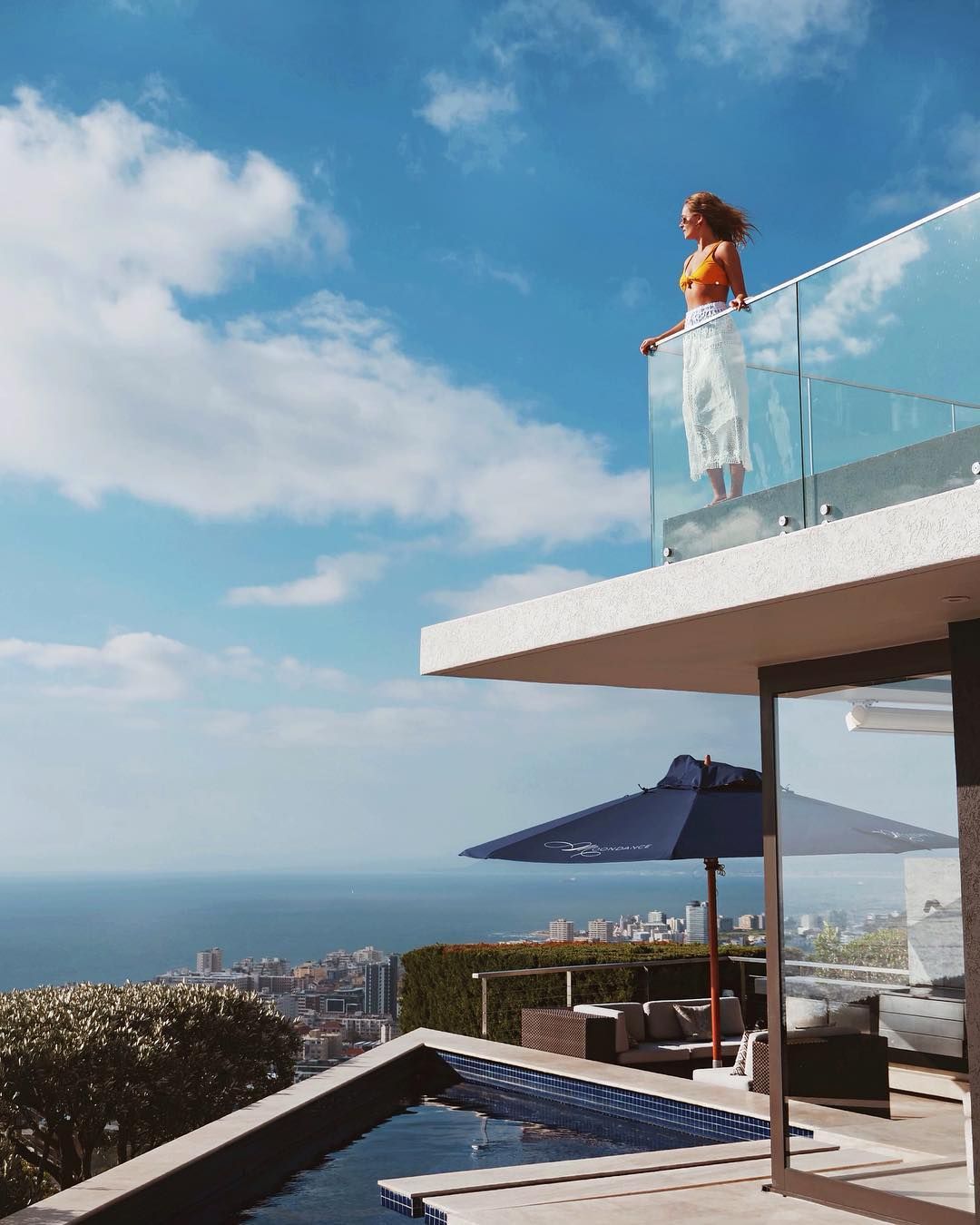 Image may contain: Moondance Villa, Eliza Batten, Made in Chelsea, South Africa, Cape Town, Building, Housing, Railing, Balcony, Banister, Handrail, Person, Human