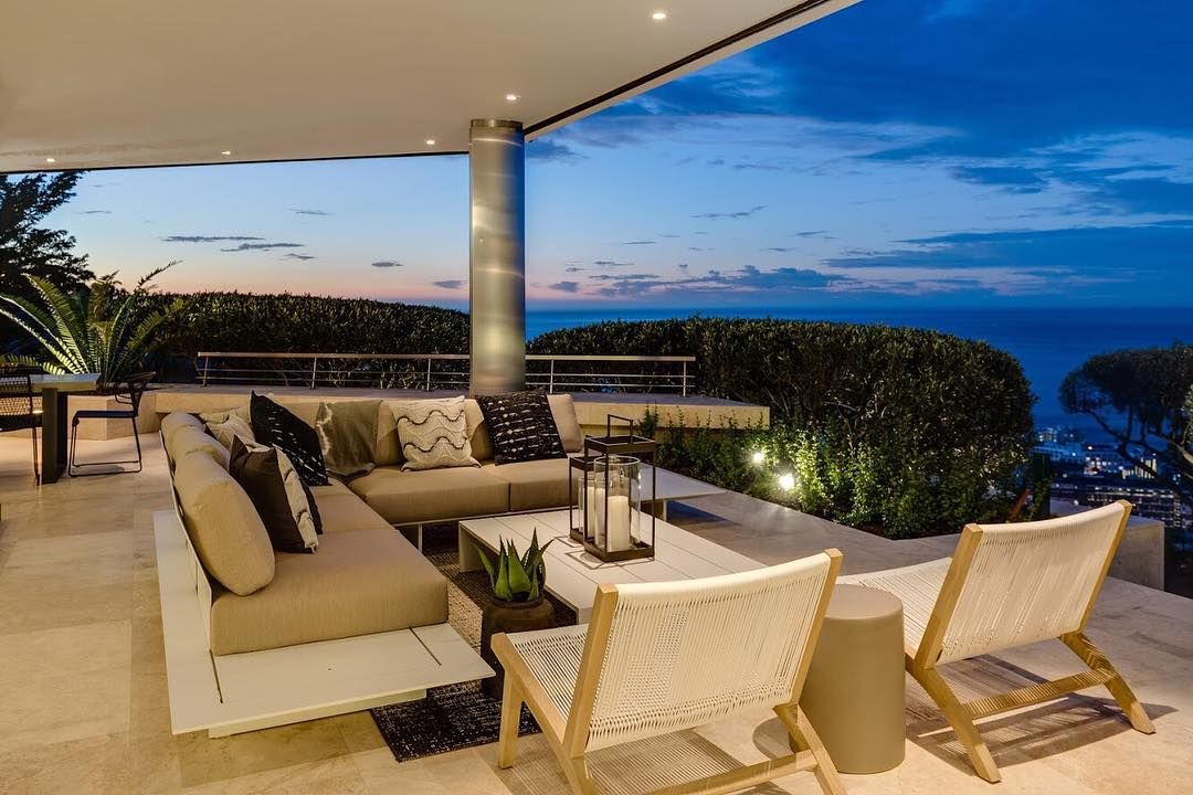 Image may contain: Moondance Villa, Made in Chelsea, Cape Town, South Africa, MIC, location, price, booking, cost, pictures, inside, Coffee Table, Couch, Table, Indoors, Housing, Building, Balcony, Chair, Furniture