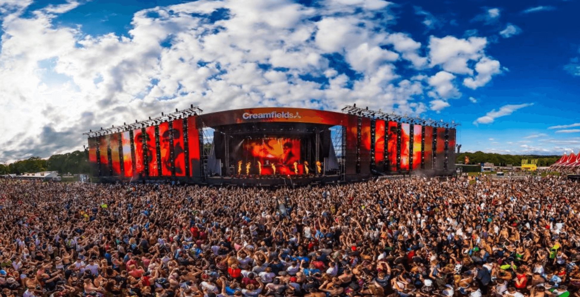 Image may contain: Festival Guide, 2019, Festival, UK, British, Creamfields, Boomtown Fair, Boomtown, line up, tickets, price, headliner, clothes, vibe, summer, guide, Concert, People, Skin, Transportation, Vehicle, Train, Audience, Festival, Crowd, Human, Person