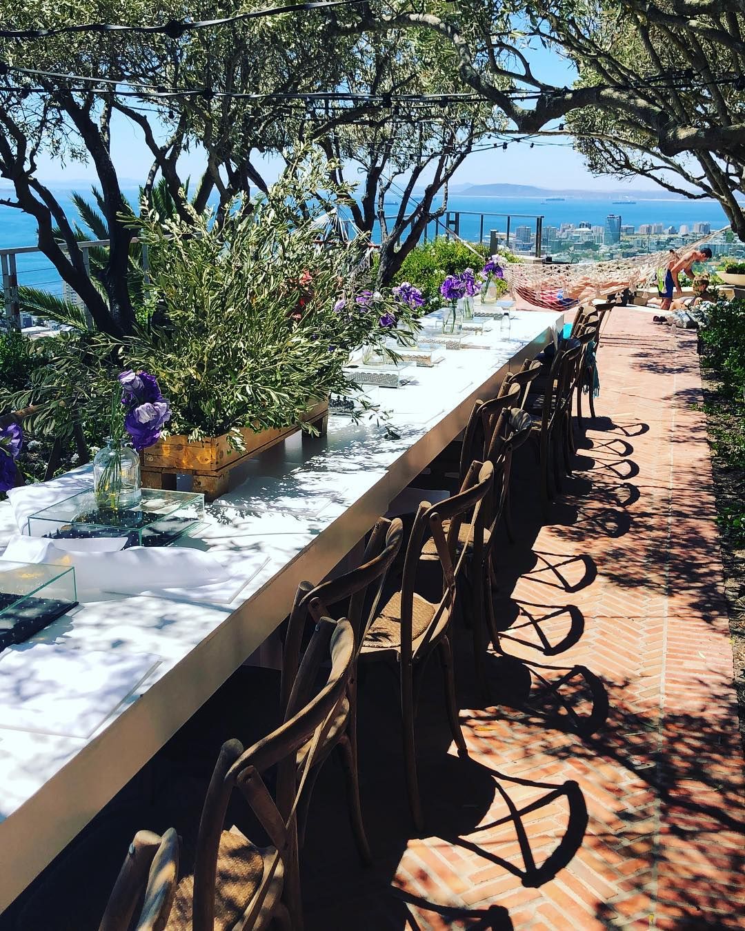 Image may contain: Moondance Villa, Cape Town, South Africa, Made in Chelsea, MIC, villa, 2019, Jar, Pottery, Vase, Potted Plant, Path, Flagstone, Plant, Human, Person, Arbour, Garden, Outdoors