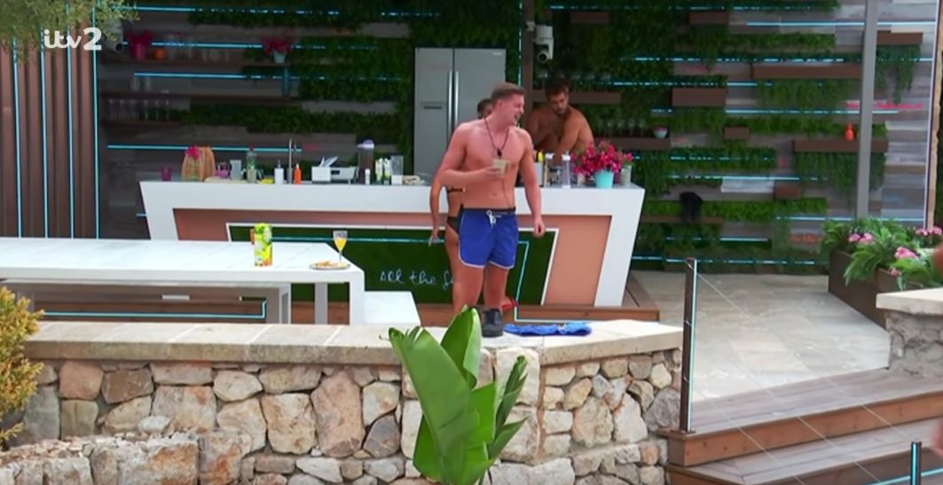 Image may contain: Love Island villa, Love Island 2019, location, Sant Llorenç des Cardassar, Outdoors, Water, Apparel, Shorts, Clothing, Person, Human