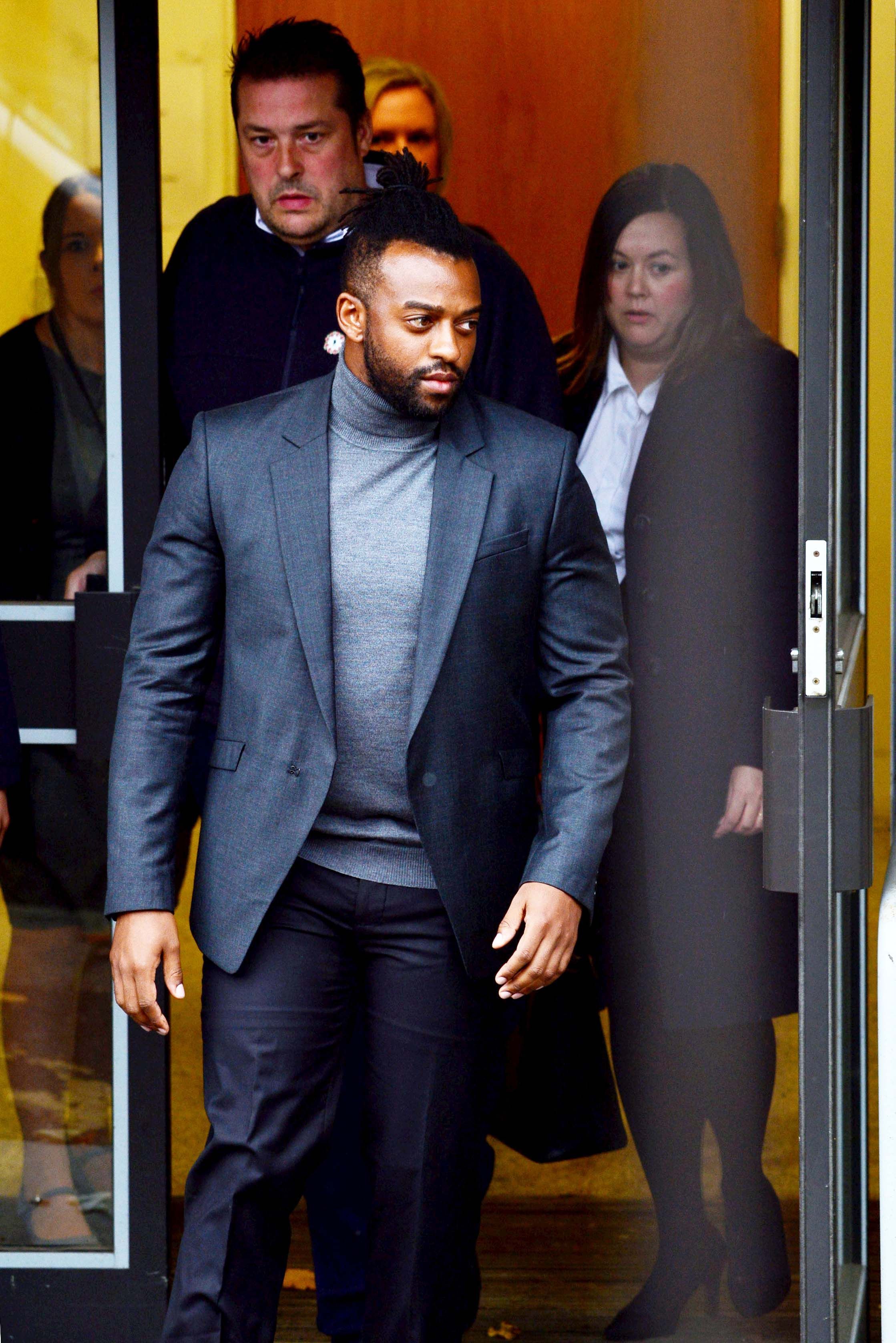 Image may contain: Ortise Williams not guilty, Oritse Williams, trial, JLS, court, result, rape, guilty, not guilty, Wolverhampton, Premiere, Apparel, Overcoat, Coat, Suit, Clothing, Fashion, Human, Person