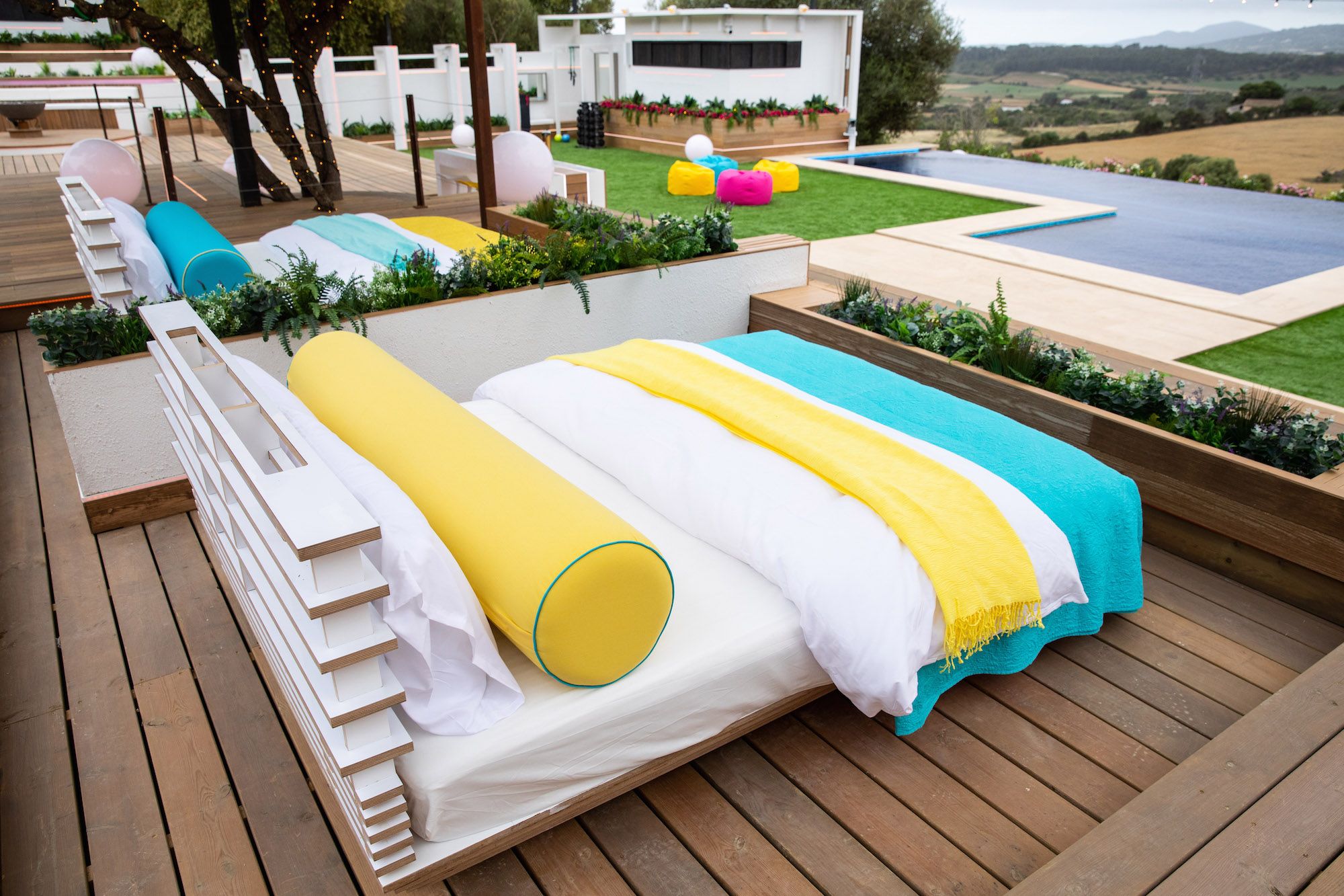 Image may contain: Love Island villa, Love Island, location, 2019, Rug, Bridge, Boardwalk, Hotel, Pool, Building, Wood, Water