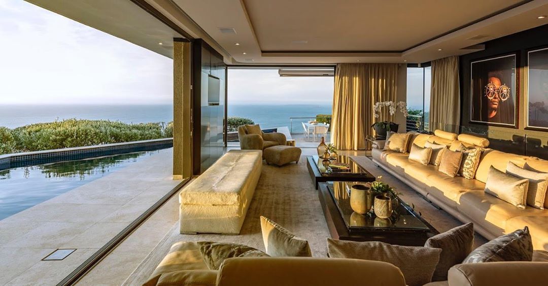 Image may contain: Moondance Villa, villa, Cape Town, Made in Chelsea, South Africa, location, inside, Rug, Table, Living Room, Room, Interior Design, Penthouse, Indoors, Furniture, Couch, Building, Housing