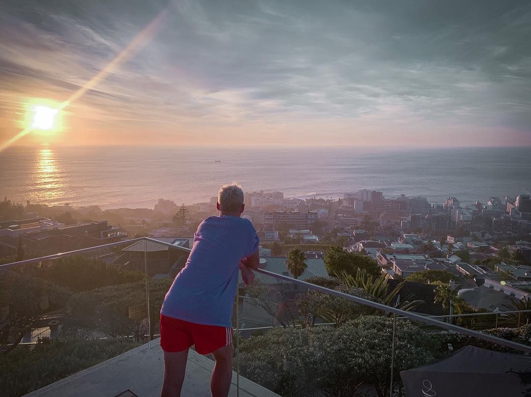 Image may contain: Moondance Villa, Made in Chelsea, Jamie Laing, Cape Town, South Africa, villa, cost, book, location, rates, price, filming, Scenery, Town, Building, City, Metropolis, Urban, Landscape, Railing, Sunrise, Sun, Shorts, Clothing, Apparel, Sky, Nature, Outdoors, Person, Human