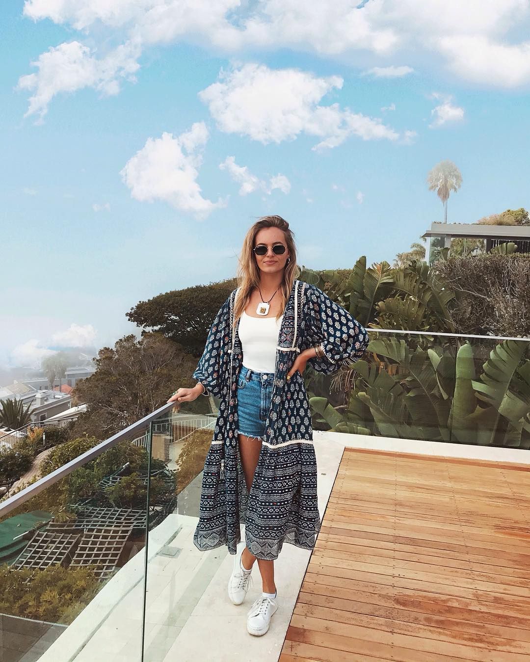 Image may contain: Moondance Villa, Cape Town, Made in Chelsea, South Africa, Eliza Batten, MIC,Sleeve, Plywood, Wood, Apparel, Clothing, Person, Human, Accessories, Accessory, Sunglasses, Balcony