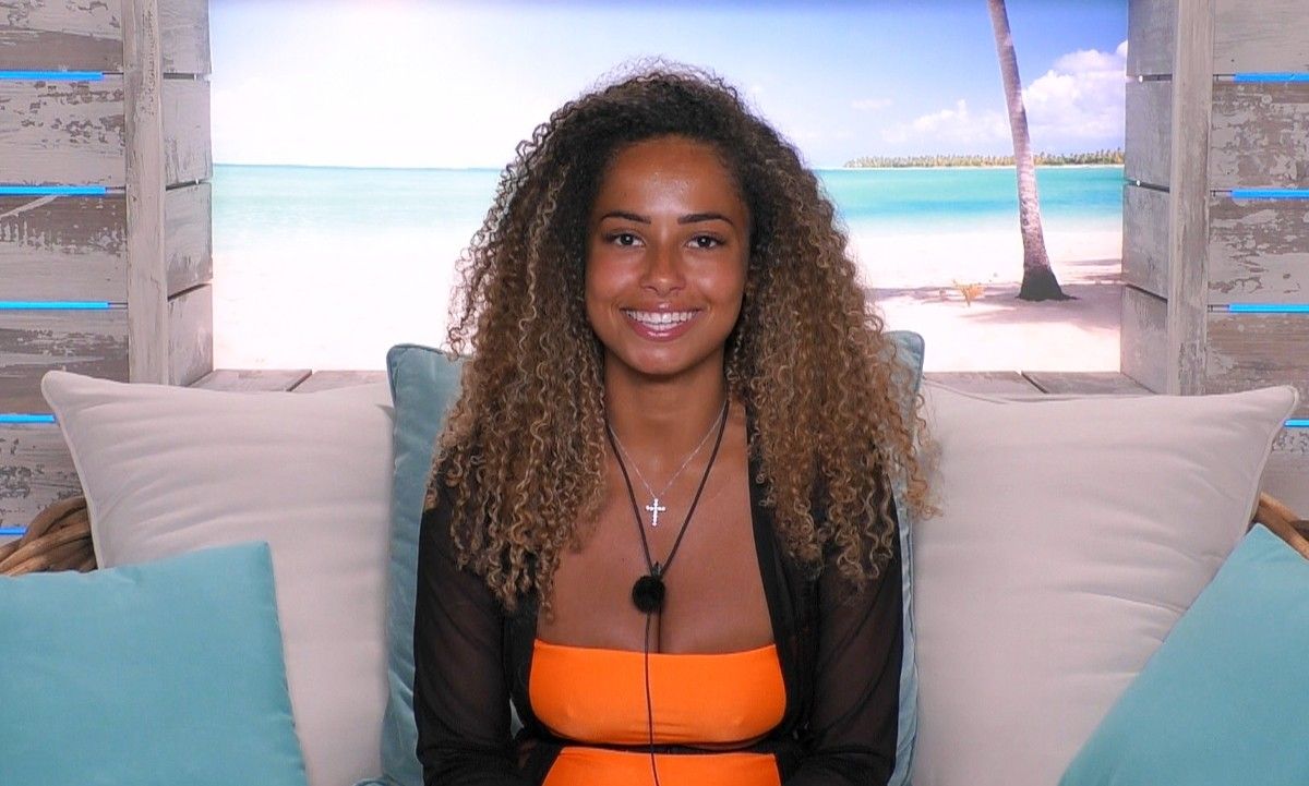 Image may contain: Love Island star signs, Amber, Love Island, Leo, star sign, compatible, age, birth, Accessory, Necklace, Jewelry, Accessories, Woman, Furniture, Couch, Clothing, Apparel, Pillow, Female, Cushion, Person, Human