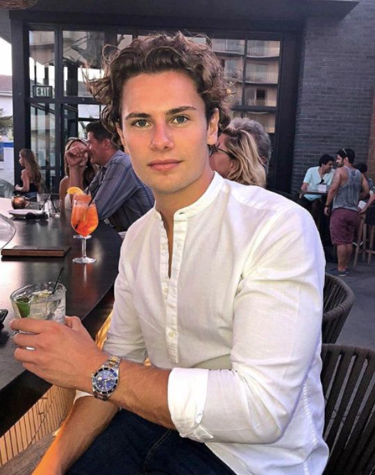 Image may contain: Dating, Chair, Furniture, Glass, Alcohol, Beverage, Drink, Bar Counter, Pub, Restaurant, Person, Human