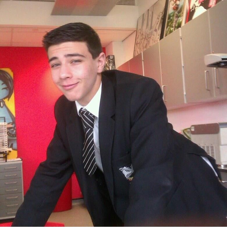 Image may contain: Tommy Fury facebook, Tommy Fury, Love Island, facebook, school, pictures, profile, before, after, transformation, change, glow up, status,  Face, Indoors, Blazer, Jacket, Desk, Table, Furniture, Person, Human, Accessories, Accessory, Tie, Suit, Apparel, Overcoat, Clothing, Coat