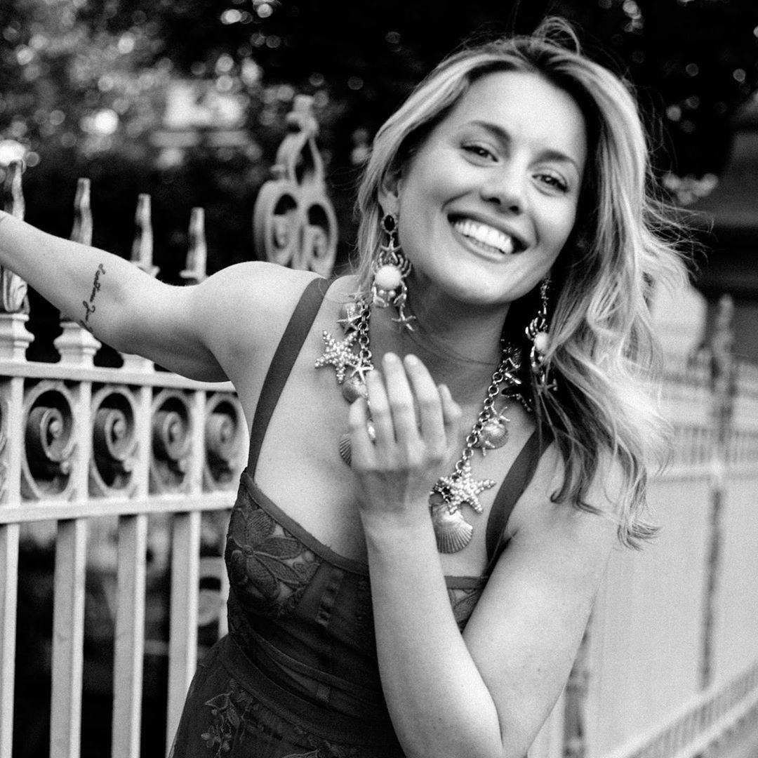 Image may contain: Made in Chelsea cast now, Made in Chelsea, cast, then, now, before, after, iconic, original, Caggie, Catherine, Dunlop,  Female, Face, Leisure Activities, Railing, Finger, Person, Human