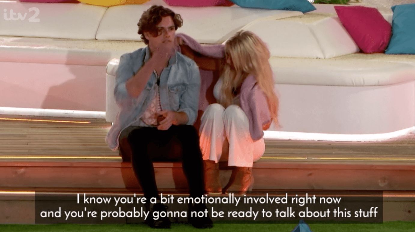 Image may contain: Joe from Love Island, Joe, Love Island, 2019, Netflix, You, meme, Lucie, red flag, Footwear, Home Decor, Sitting, Clothing, Apparel, Human, Person, Couch, Furniture
