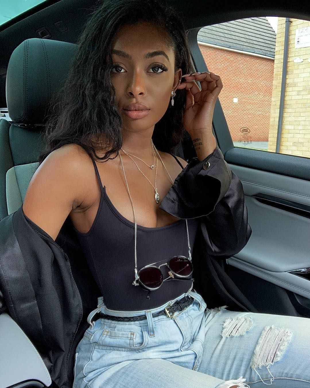 Image may contain: Casa Amor Islanders, Casa Amor, Love Island, Jourdan Riane, latest, cast, Islander, contestant, news, gossip, new, girl, boy, late arrival, Headrest, Belt, Accessory, Accessories, Person, Human, Cushion