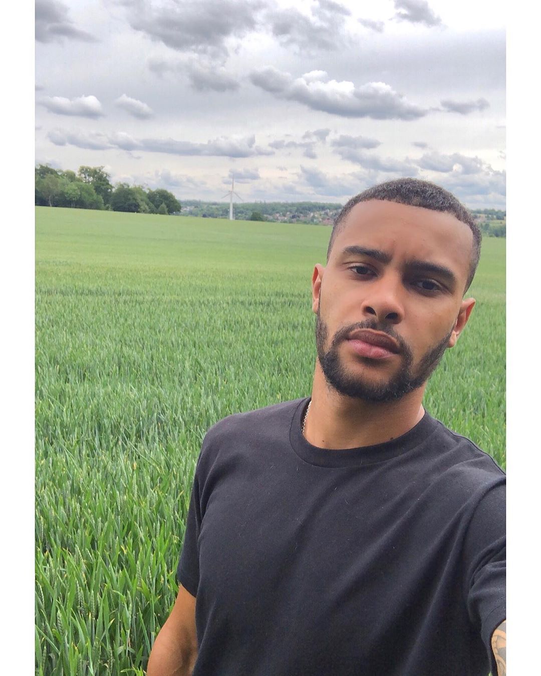 Image may contain: Casa Amor Islanders, Casa Amor, Love Island, Dennon Lewis, Islander, cast, contestant, new, Instagram, rumours, gossip, lineup, latest, date, Land, Paddy Field, Beard, Man, Vegetation, Countryside, Grass, Plant, Grassland, Field, Outdoors, Nature, Face, Person, Human