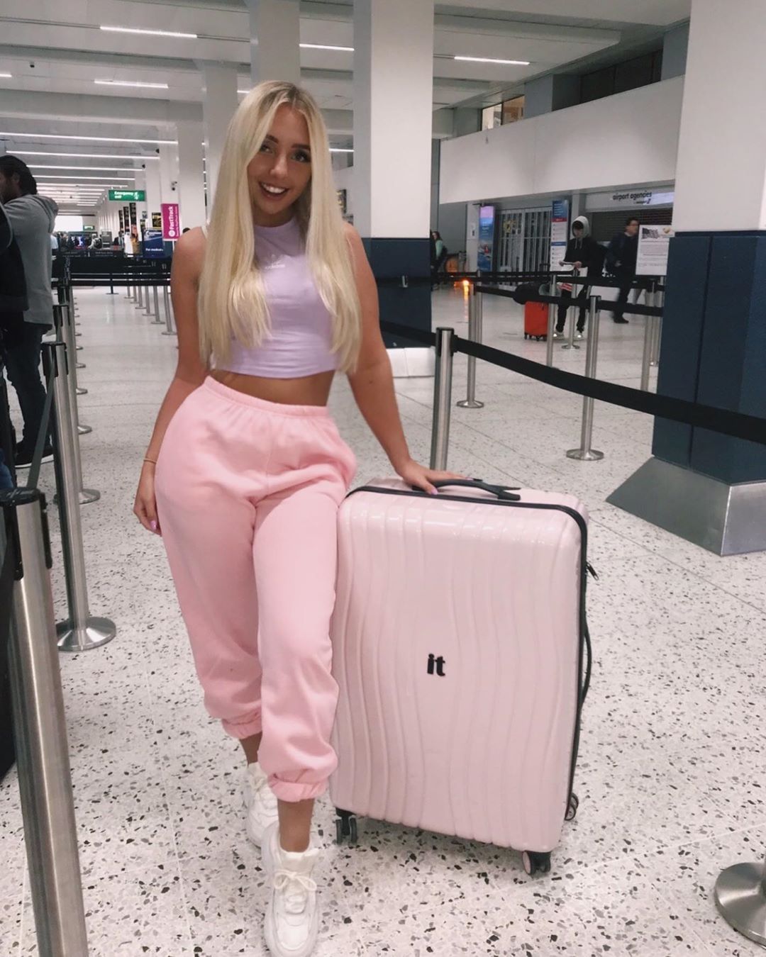 Image may contain: Tommy Fury ex girlfriend, Tommy Fury, ex, girlfriend, Millie Roberts, airport, Love Island, Casa Amor, villa, contestant, Islander, Long Sleeve, Sleeve, Luggage, Clothing, Apparel, Person, Human