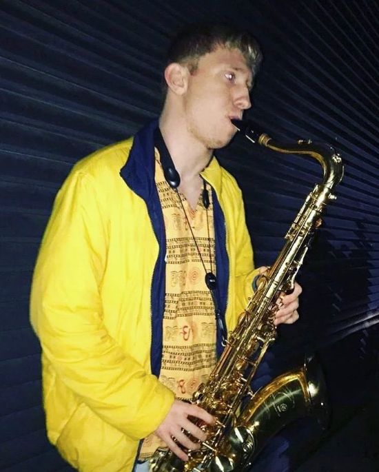 Image may contain: Musical Instrument, Saxophone, Leisure Activities, Human, Person
