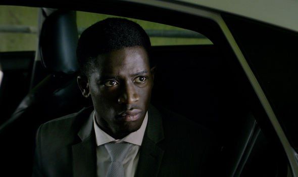 Image may contain: Smithereens ending explained, Black Mirror, Smithereens, season 5, episode 2, conclusion, ending, spoilers, easter eggs, died, death, answers, explained, Jaden, Damson Idris, Photo, Portrait, Photography, Man, Accessory, Accessories, Tie, Suit, Clothing, Apparel, Coat, Overcoat, Human, Face, Person