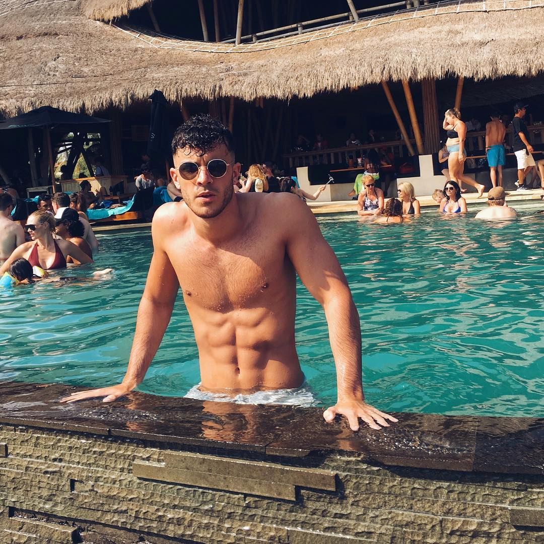 Image may contain: Dan Rose, Love Island, Casa Amor, villa, bombshell, Islander, contestant, cast, late, new, arrival, boy, Vacation, Countryside, Swimming Pool, Nature, Outdoors, Sunglasses, Accessory, Accessories, Resort, Hotel, Pool, Building, Person, Human, Water
