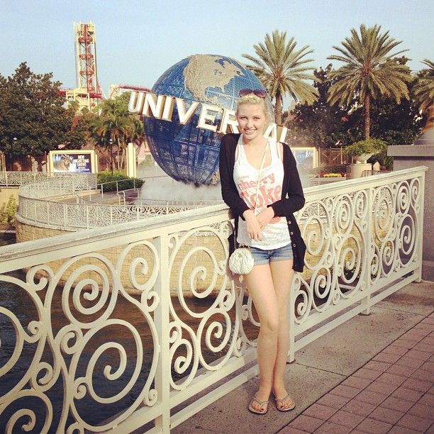 Image may contain: Woman, Railing, Palm Tree, Arecaceae, Tree, Theme Park, Amusement Park, Plant, Female, Apparel, Shorts, Clothing, Human, Person