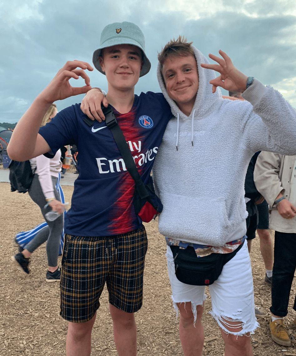 Image may contain: Alex Mann, Alex from Glastonbury, Glastonbury, Festival, Dave, rapping, boy, Glasto, stage, full video, Instagram, twitter, who, Alex, Baseball Cap, People, Sweater, Cap, Sleeve, Hat, Shoe, Footwear, Human, Person, Shorts, Apparel, Clothing