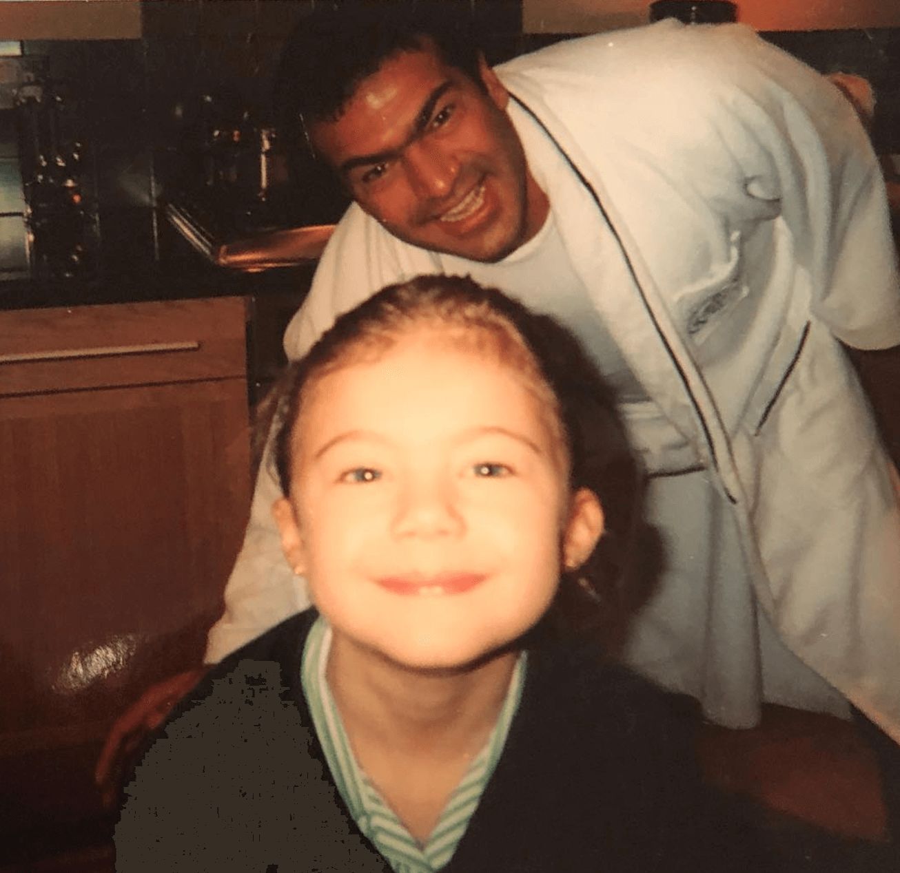 Image may contain: Love Island parents, Love Island, mum, dad, Belle, Tamer Hassan, Karen Hassan, Child, Kid, Couch, Laughing, Portrait, Photo, Photography, Furniture, Night Life, Accessories, Accessory, Glasses, Meal, Food, Clothing, Apparel, Bar Counter, Pub, Cushion, Pillow, Smile, Face, Human, Person