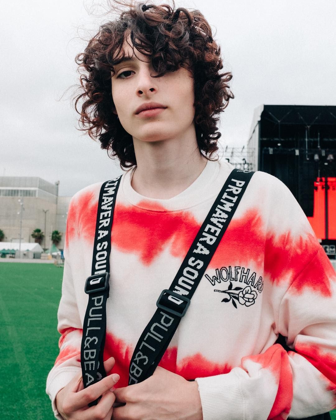 Image may contain:  Stranger Things cast ages, Stranger Things, 3, cast, age, old, birthday, Finn Wolfhard, Mike, Clothing, Sleeve, Apparel, Musical Instrument, Musician, Person, Human