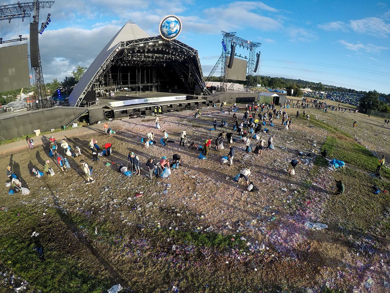 Image may contain: Crowd, Soil, Human, Person, Architecture, Animal, Bird, Building