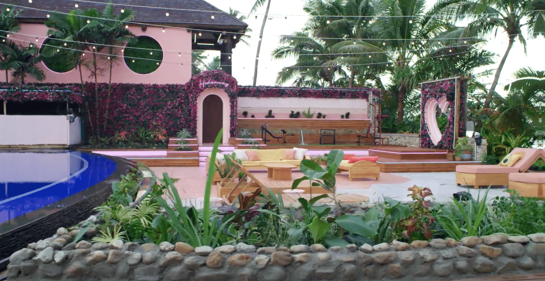 Image may contain: Love Island USA villa, Love Island USA, villa, Love Island, CBS, Fiji, Pacific, Ocean, Housing, Building, Jar, Pottery, Vase, Potted Plant, Nature, Yard, Plant, Slate, Arbour, Garden, Outdoors
