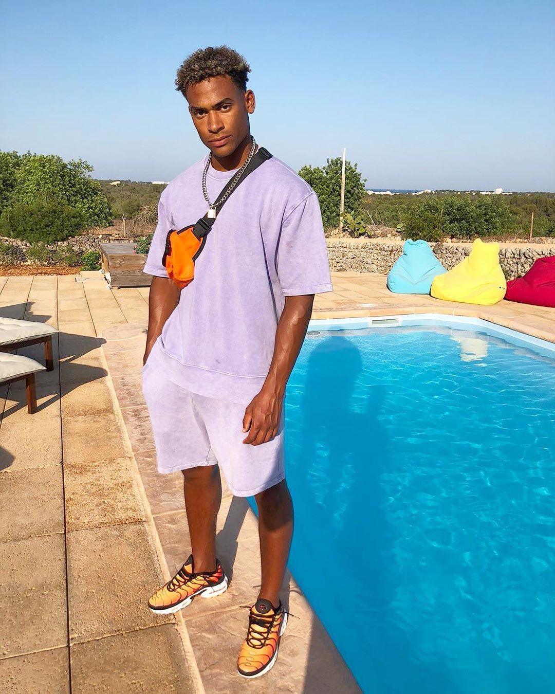 Image may contain: Love Island Instagrams, Love Island, Instagram, followers, ranking, 2019, Jordan, Outdoors, Shoe, Footwear, Flagstone, Pool, Water, Shorts, Clothing, Apparel, Human, Person