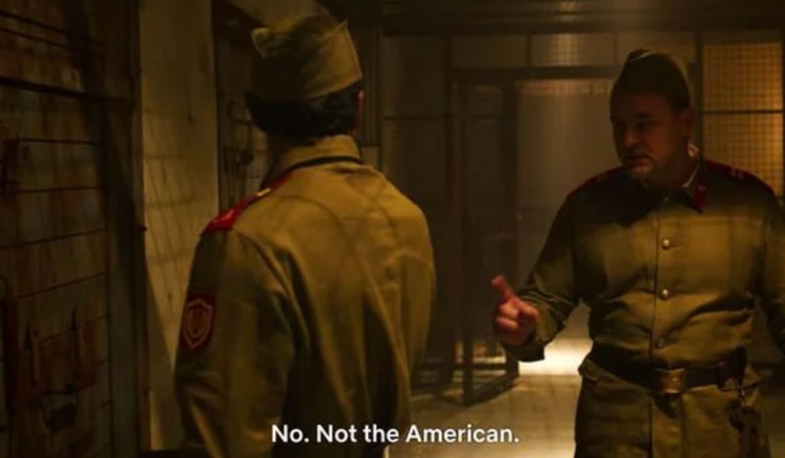 Image may contain: Stranger Things 3 end credit scene, post credits, Stranger Things 3, explained, theory, theories, ending, Russian, cell, prison, is Hopper dead, who, the American, door, spoilers, Netflix, finale, Stranger Things,  Person, Human