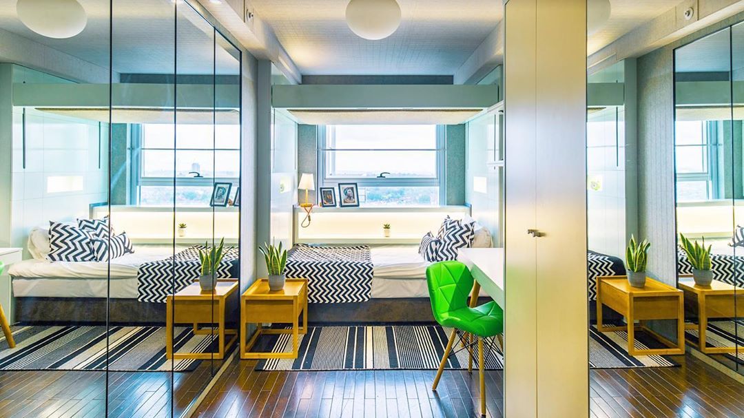 Image may contain: Rug, Interior Design, Room, Furniture, Chair, Indoors, Building, Housing