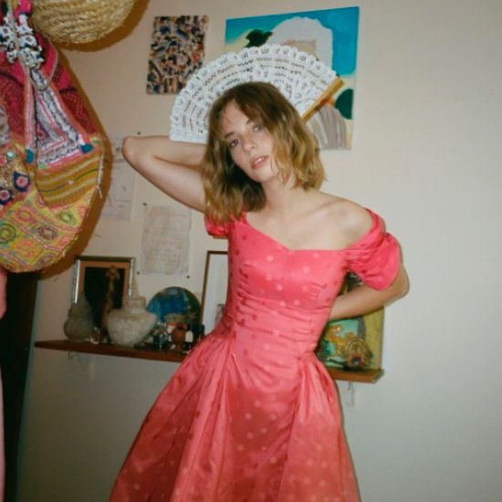 Image may contain:  Stranger Things cast ages, Stranger Things, 3, cast, age, old, birthday, Maya Hawke, Robin, Sombrero, Female, Hat, Costume, Person, Human, Wedding, Wedding Gown, Robe, Fashion, Evening Dress, Gown, Dress, Apparel, Clothing