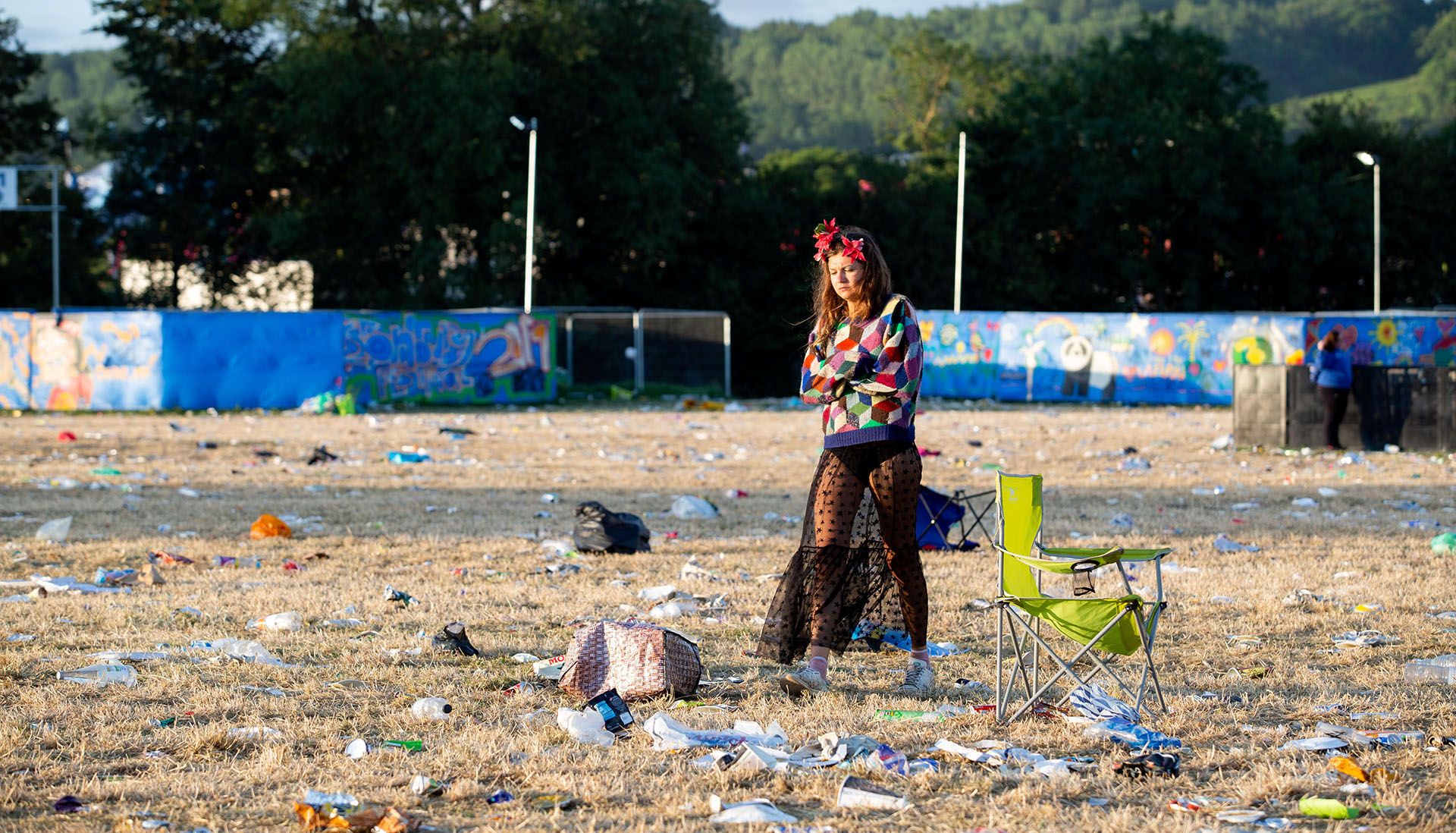 Image may contain: Spoke, Machine, Animal, Bird, Trash, Clothing, Apparel, Gravel, Dirt Road, Road, Ground, Person, Human