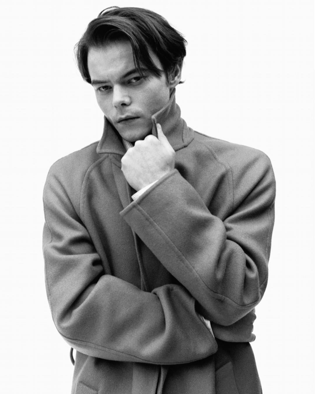Image may contain:  Stranger Things cast ages, Stranger Things, 3, cast, age, old, birthday, Charlie Heaton, Jonathan, Suit, Man, Jacket, Face, Overcoat, Coat, Fleece, Person, Human, Apparel, Clothing