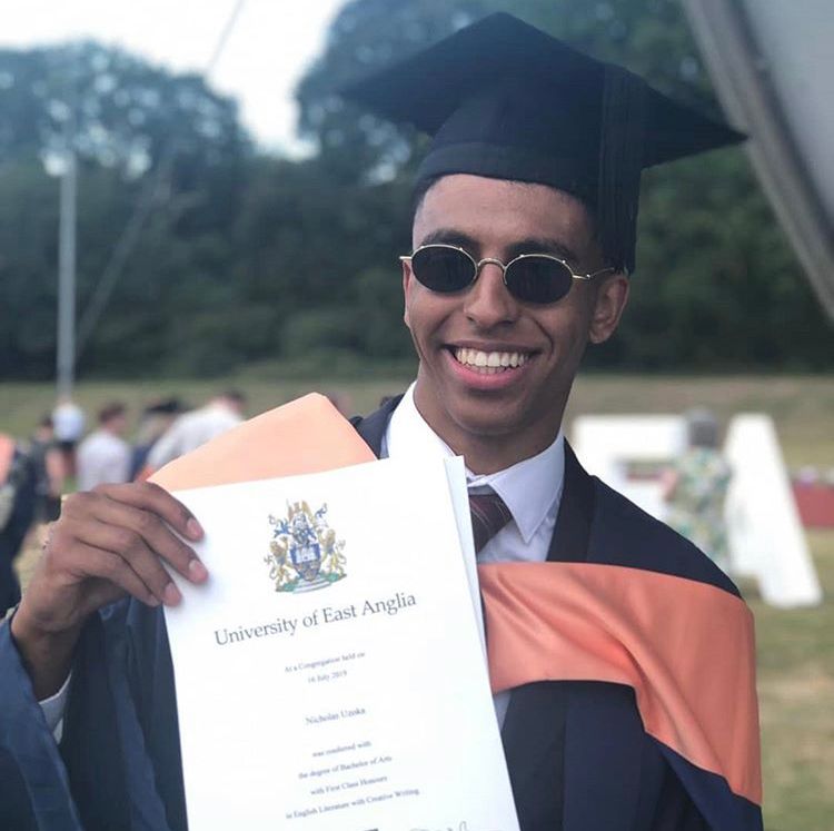 Image may contain: Tie, Diploma, Document, Text, Graduation, Sunglasses, Accessories, Accessory, Human, Person