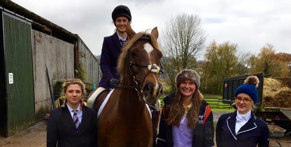 Image may contain: Accessory, Tie, Accessories, Equestrian, Face, Coat, Overcoat, Suit, Horse, Animal, Mammal, Apparel, Clothing, Human, Person