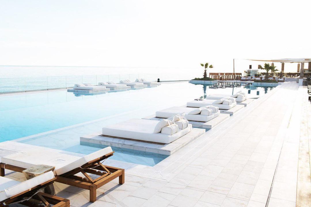Image may contain: Abaton Island resort, Celebs Go Dating, final, Abaton Island Resort & Spa, Crete, Greece, Abaton, hotel, Island, bar, Aircraft, Transportation, Airplane, Vehicle, Bench, Terrace, Furniture, Swimming Pool, Pool, Water