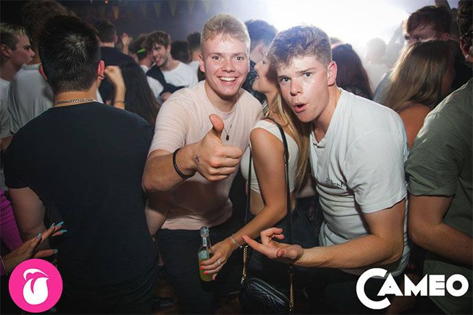 Image may contain: Audience, Crowd, Pub, Bar Counter, Night Club, Party, Club, Person, Human